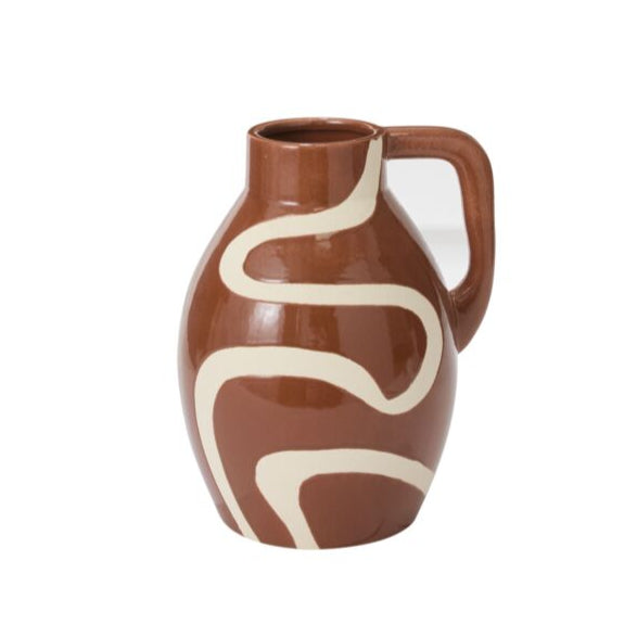 Ceramic vase with brown and white design on a white background